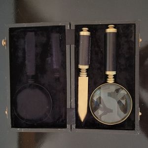 Vintage brass and leather magnifying glass and letter opener in case.